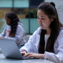 Student taking online course outdoors