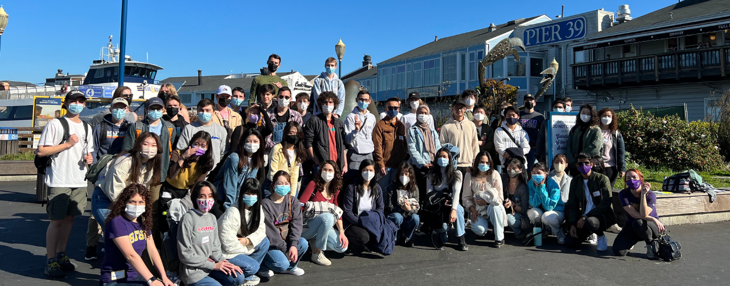 International students about to take a bay cruise. Many wear masks.