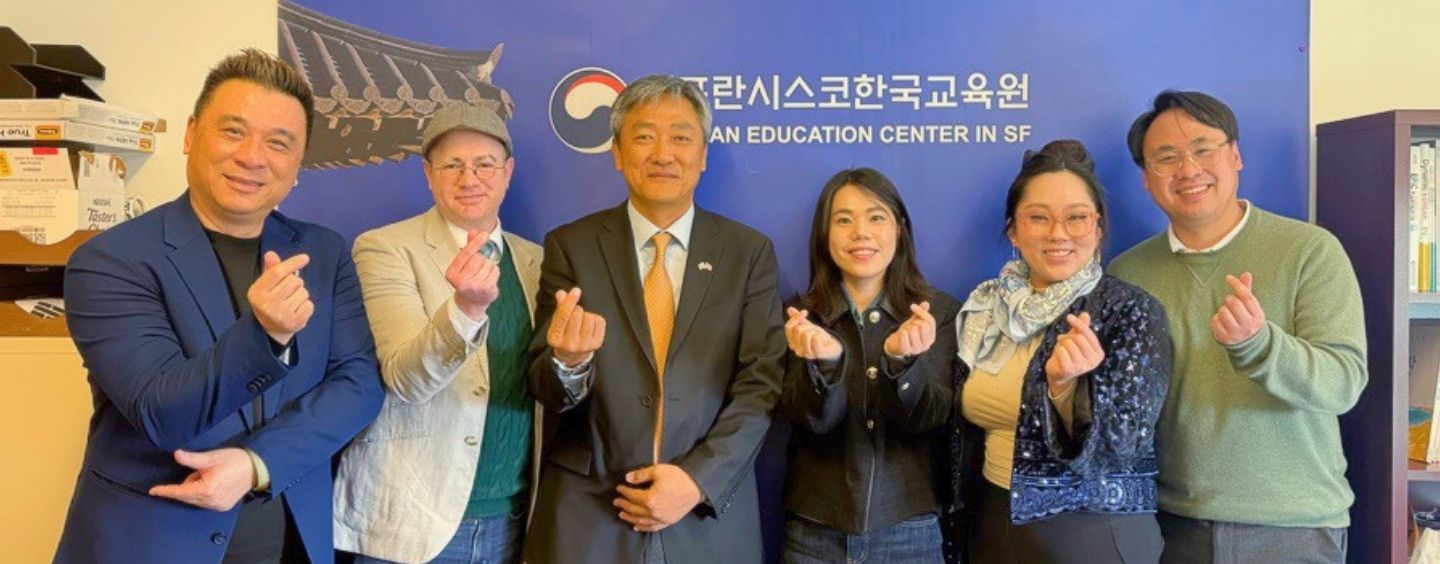 King Sejong Institute and SFSU representatives give finger hearts