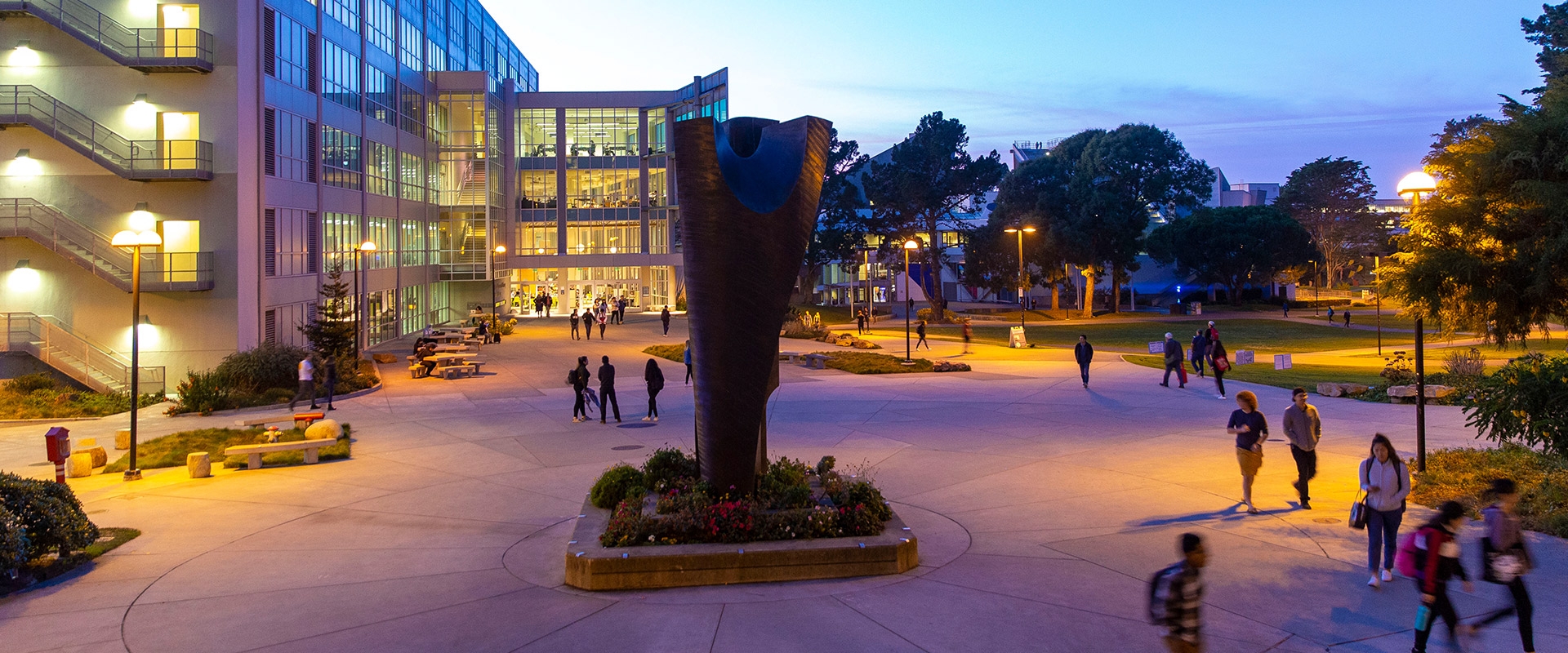 SF State campus sculpture and library at twilight