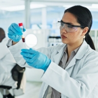 Specialist in Blood Bank Technology working in the lab with other scientists