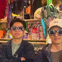 International students wear wacky glasses in a fun shop in San Francisco