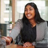 Paralegal shakes hands at a job interview