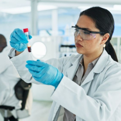 Specialist in Blood Bank Technology working in the lab with other scientists