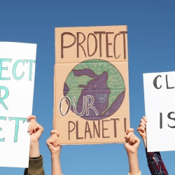 Protester sign that reads "Protect our planet"