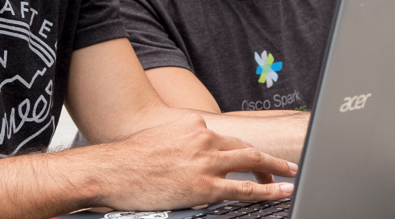 Close-up of student's hands on laptop