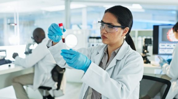 Specialist in Blood Bank Technology working in the lab with other scientists